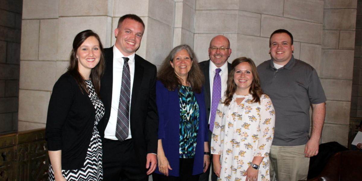 Judge Laurie Yardley (center) and husband, Owen (center back) and family celebrate swearing-in of son, Michael (center left), during April 18 ceremony in the State Capitol.