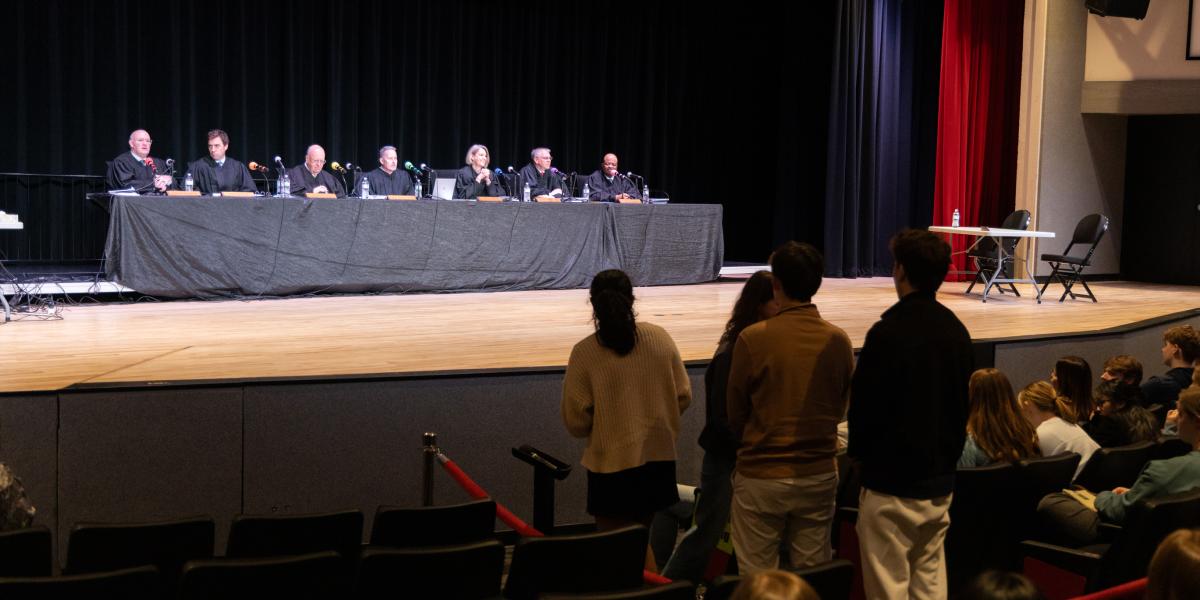 Students line up to ask questions