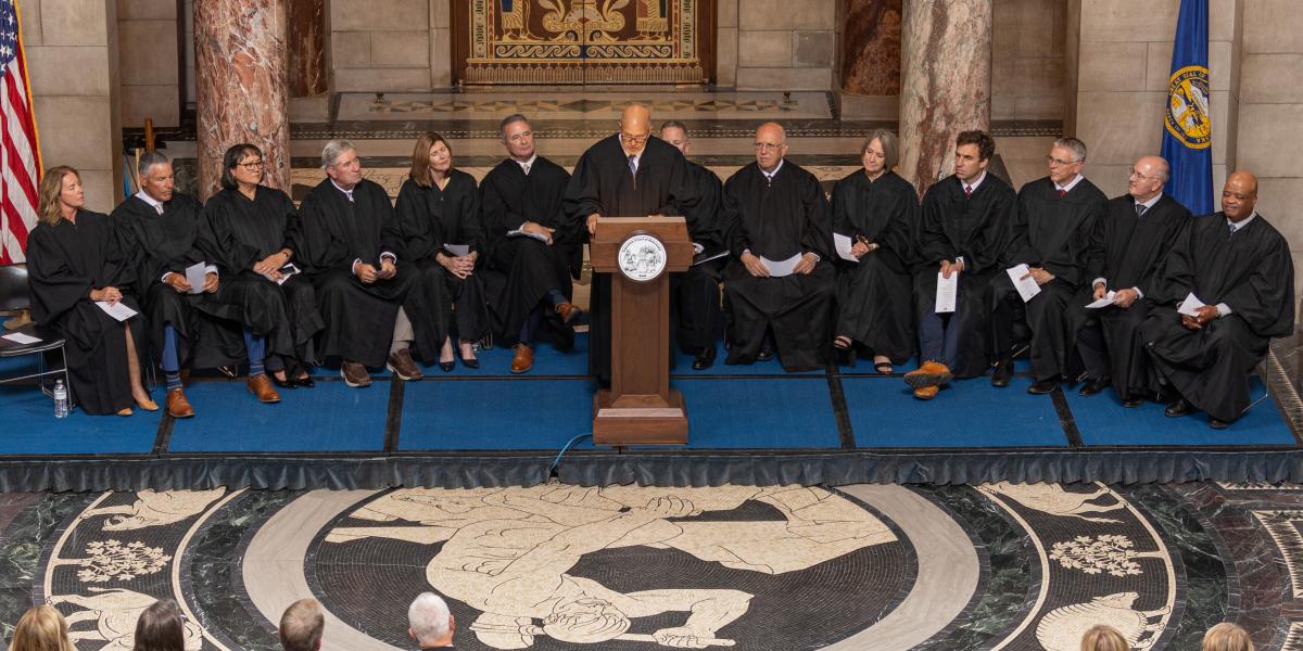 Judge Piccolo speaking at podium