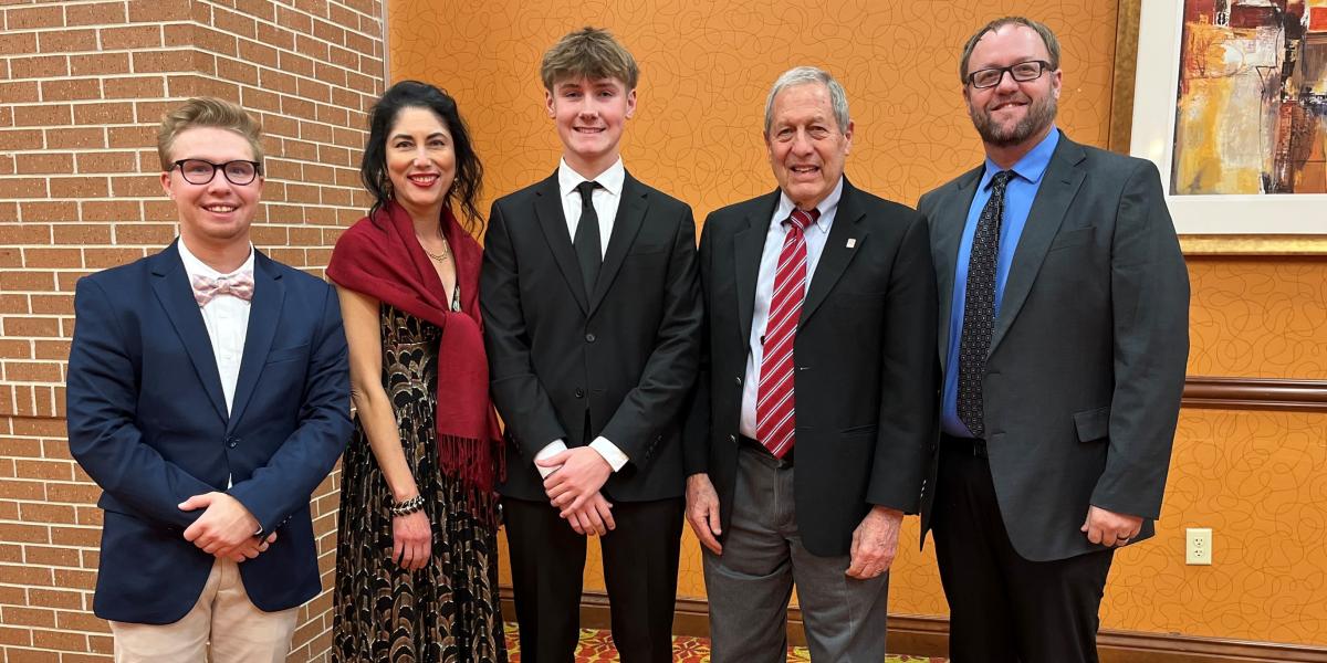 Photo (L-R): Teacher Coach Berkly Brummon, attorney coach Sandy Brown, student news reporter Landen Sharer, attorney coach Retired Judge Robert Ensz, and Teacher Coach Josh Johnson.