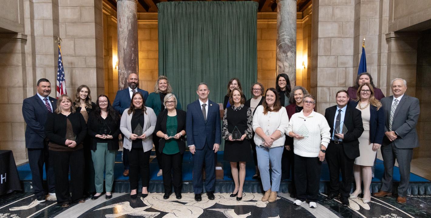 Back row: Corey Steel, Kasey Stallbaum, Scott Lord, Ashley Laux, Mary Pat Coe, Stephanie Volkmer, Theresa Cusic, Deb VanDyke-Ries, Kari Corkle, and Gene Cotter.  Front row: Annette Shafer, Sarah Acri, Megan Perkins, Jeanine Hrdlicka, Chief Justice Jeffrey Funke, Wendy Dethlefs, Jordan Hernandez, Traci Webber, Theo Raumaker, and Kathleen Valle.