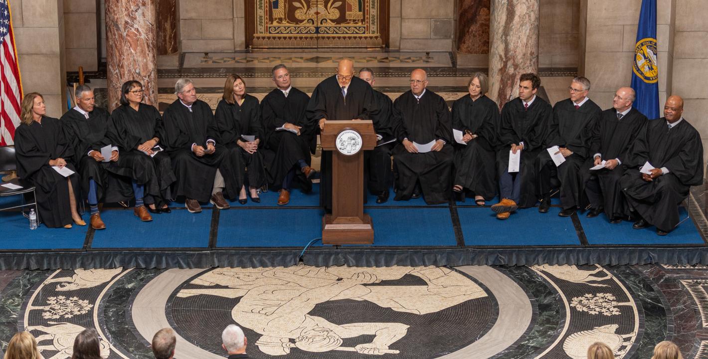 Judge Piccolo speaking at podium