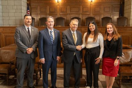 Court Administrator Corey Steel, Justice Jeffrey Funke, Chief Justice Michael Heavican, Court graduate Marisela Morales-Padilla, and Judge Shelly Stratman