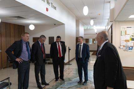 District Court Judge Timothy Hoeft shows off the mosaic in the floor of the Harlan County courthouse.