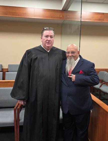 Judge Nathan Cox with the graduate.