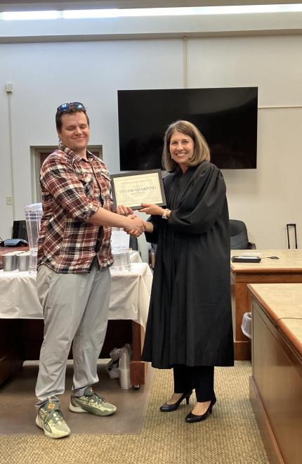 Judge Tina Marroquin and graduate Tylor Sharping