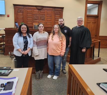 Photo L to R: Treatment Officer Courtney Elliot, graduates Courtney, Jamie, Pat, and Judge Michael A. Smith. 