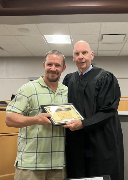 (L to R) graduate Curtis and Judge Geoffrey Hall.