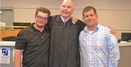 Photo L to R: graduate Damian, Judge Geoffrey Hall, and graduate Frank.  Picture Courtesy of Fremont Tribune.