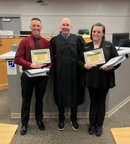 Photo: Judge Geoffrey Hall with Graduates.