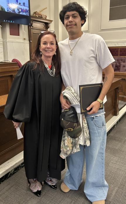 Photo: Judge Shelly Stratman with graduate Andrew.