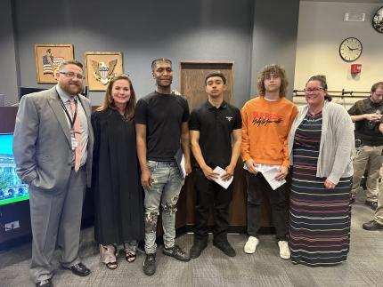 judge and graduates