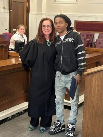   Photo: Judge Shelly Stratman with Graduate Deandre. 