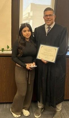 Photo: Graduate Nadia with Judge James Masteller.