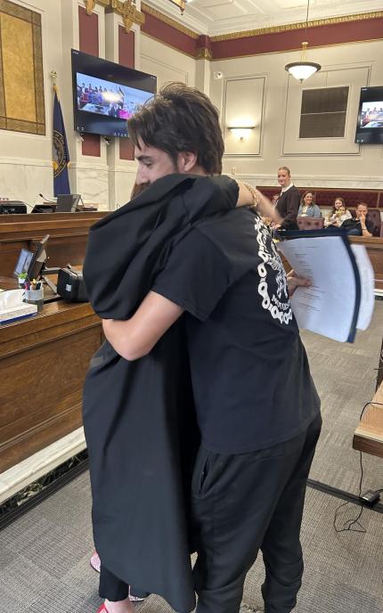Judge Shelly Stratman congratulating Graduate Michael.