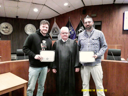 Photo (L to R): Graduate Damian, Judge Timothy Burns, and Graduate Jonathan.