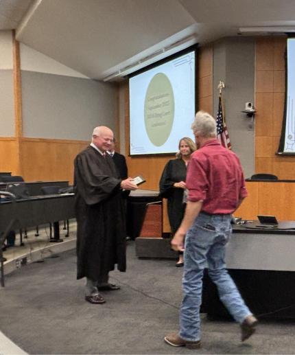 Judge John Colborn with Graduate.