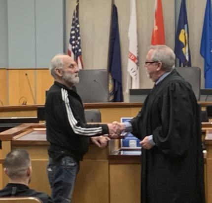 Graduate with Judge