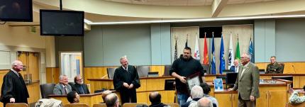 The graduates, Cortez and Cody, receiving their certificates.