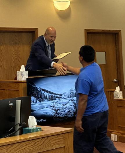 Judge Piccolo and Graduate  Mauricio 