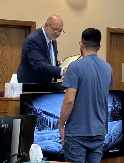 Judge Michael Piccolo and Graduate Jesus