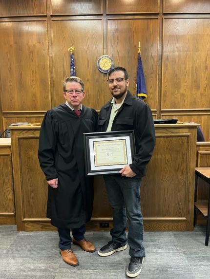 Photo: Judge Ryan Stover with Graduate Trevor.