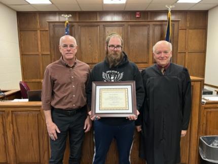 Photo (L to R): Retired Judge James Kube, graduate Timothy, and Judge Mark Johnson.
