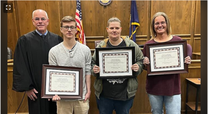 Photo L to R: Judge James Kube with graduates David, Tifani, and Melissa. Picture courtesy of Norfolk Daily News.