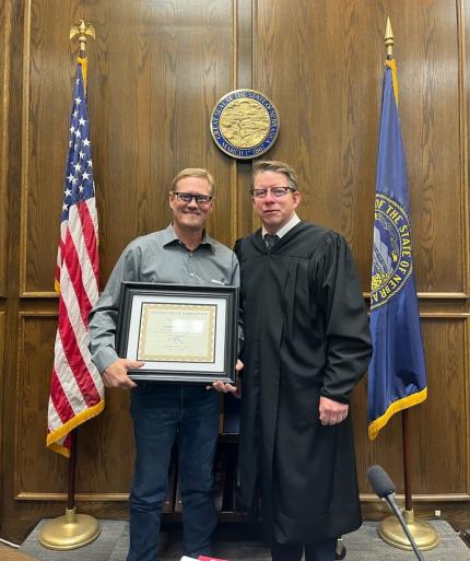 Graduate Anthony with Judge Ryan Stover. 