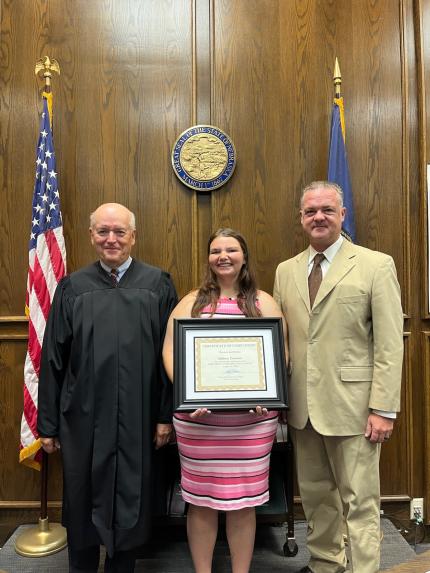 Photo: Judge Mark Johnson, graduate Addison, and Attorney Michael Moyer.