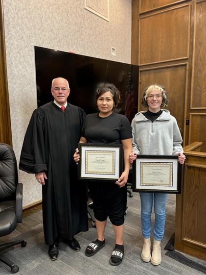 judge and graduates