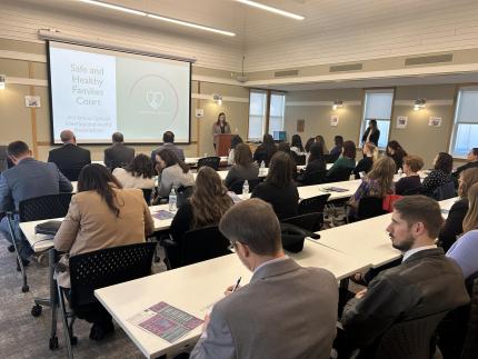 Judge Elise White presenting to the group.