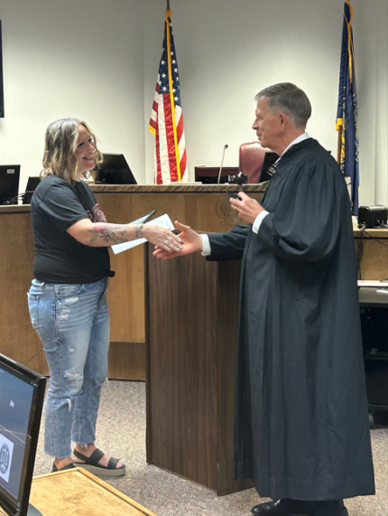 Graduate Jenifer with Judge James Stecker.