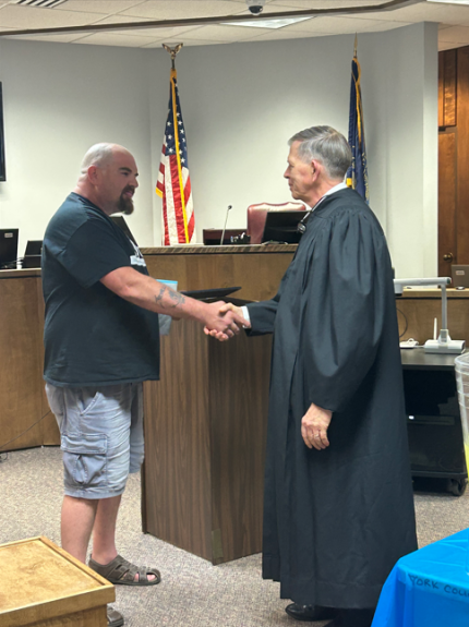 Graduate Brian with Judge James Stecker.
