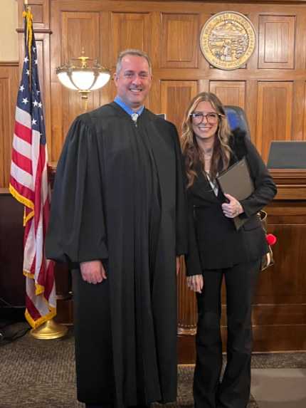 Photo: Judge David Bargen with graduate Savannah.
