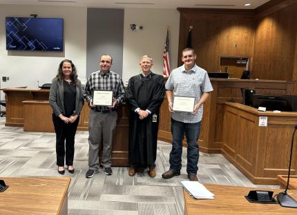 Specialized Populations Officer Brandi Baldassano and Judge James Stecker with graduates.