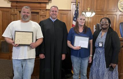 Photo (L to R): Graduate, Judge David Bargen, Graduate, and Supervision Officer Nichole Mosley.