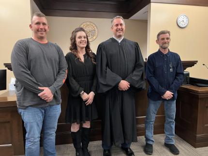 Photo L to R: Graduate Matthew, graduate Jennifer, Judge David Bargen, and graduate Corey.