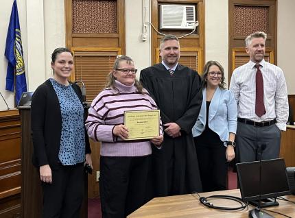 Photo (L-R): Drug Court Supervision Officer Chelsea Hagedorn, Graduate Brenda, Judge Richard Smith, Drug Court Assistant Probation Officer Chelsea Byfield, and Drug Court Specialist Supervision Officer Marty Metschke.