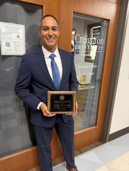 William Acosta-Trejo with award of appreciation