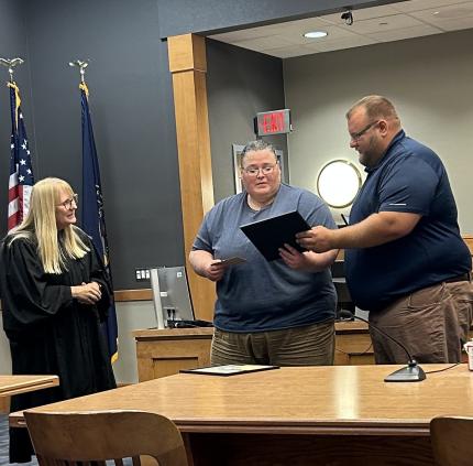 Bottom Photo: Judge Rachel Daugherty, Graduate Jessica, and Specialized Officer Kyle Hohnholt.