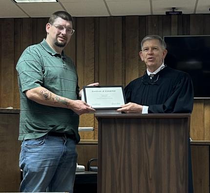 Graduate Jimmy with Judge James Stecker.