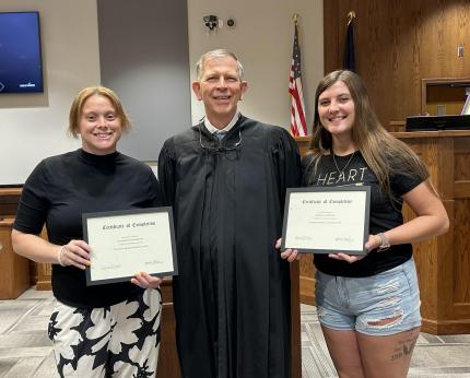 Photo: Graduate Elizabeth, Judge James Stecker, and Graduate Serenity.
