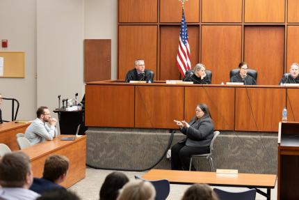 : Creighton student utilizes sign language interpreter during Supreme Court arguments and the Court’s question-and-answer session during 2025 visit.