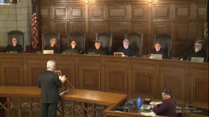 Judge Molly Keane, far left, sits with the Nebraska Supreme Court.