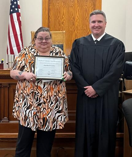 Photo: Graduate Jennifer with Judge Richard Smith.
