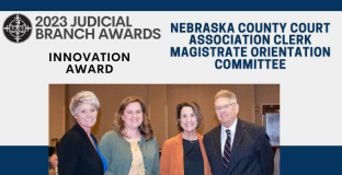 Photo, from left: Debra Hand, Sara Fowler, Ellen Faltys, and Chief Justice Mike Heavican – not pictured are Cathy Reiman and Vicki Kuhlman.