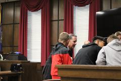 Justice Jeff Funke second from left, coaches students during morning 5th grade job shadow mock trial in Otoe County
