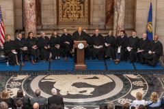 Judge Piccolo speaking at podium