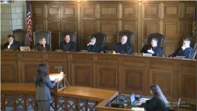 Lancaster County District Judge Post sits with Nebraska Supreme Court